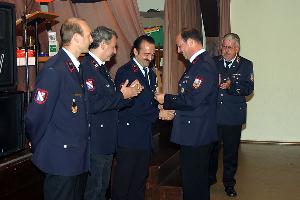 Bild: Fanfarenzugführer Jörg Olliger ehrte drei Mitglieder für ihr langjähriges Engagement